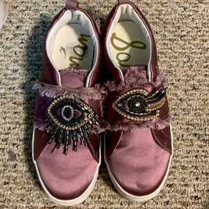 Purple slip on sneakers with design